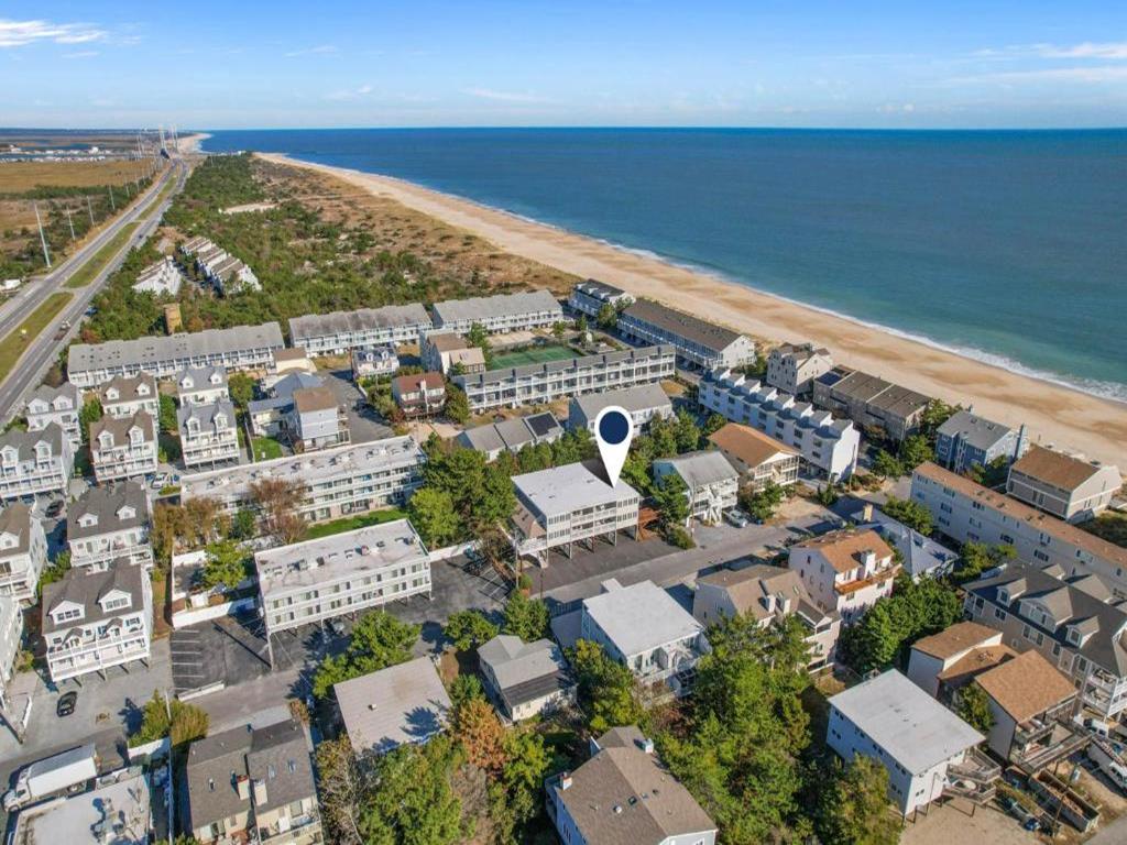 image Just 50 yards from the private community beach, enjoy unparalleled access to the pristine shoreline within the picturesque Tower Shores community.
