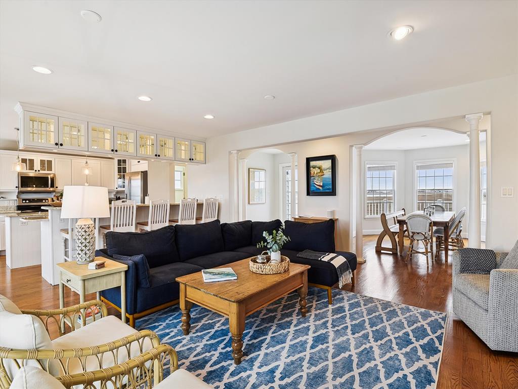 image This elegantly designed living space features vaulted ceilings and abundant natural light, perfectly situated for ocean views, making it an ideal setting for relaxation and entertainment.