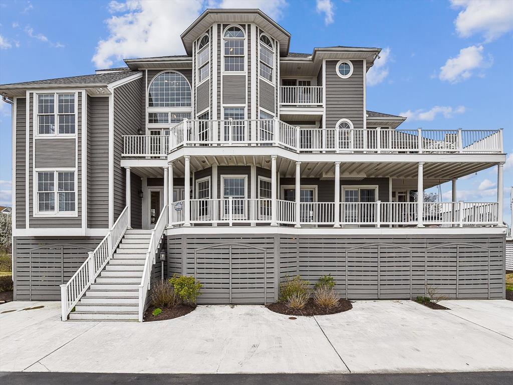 image This stunning luxury beach house features expansive decks and vaulted ceilings, perfectly positioned to offer scenic waterfront views.