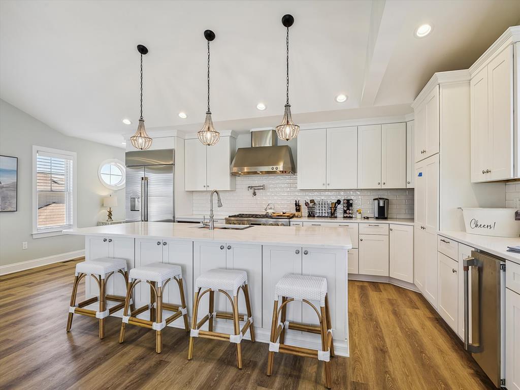 image Sleek and modern kitchen with a breakfast bar and bright design, creating an ideal hub for family meals.