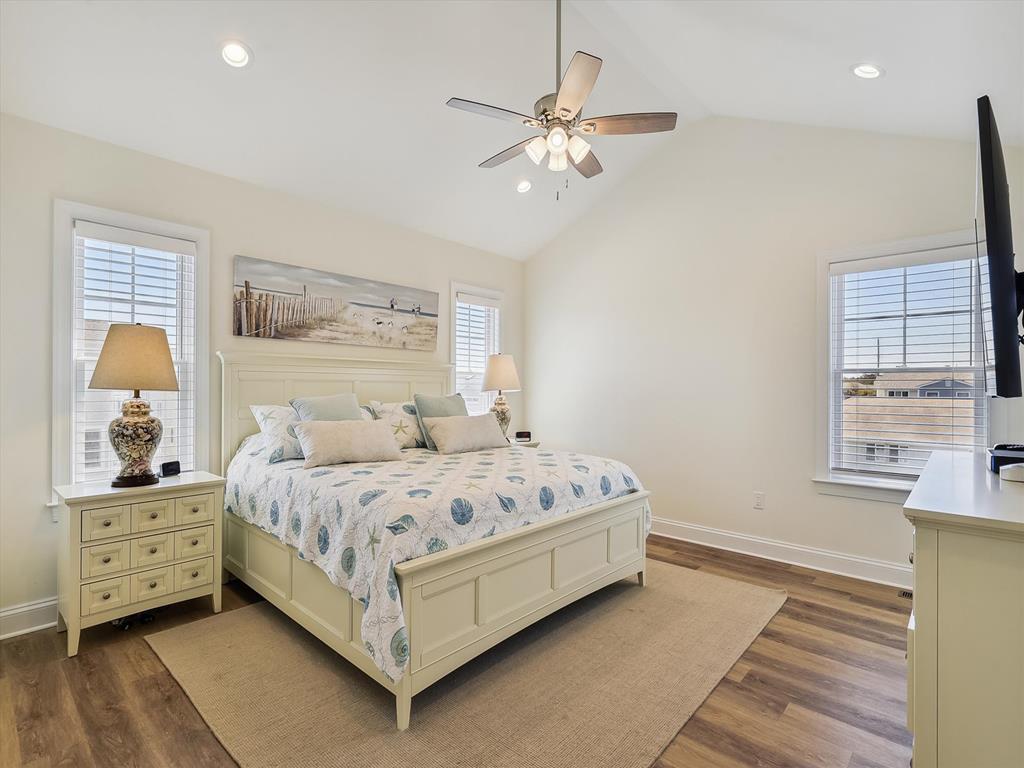 image Spacious bedroom with coastal-inspired decor and natural light, offering a serene space for rest and relaxation.