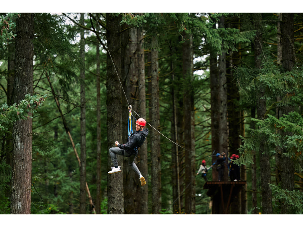 image Soar through the trees at the Aerial Park – an exhilarating experience for all ages.