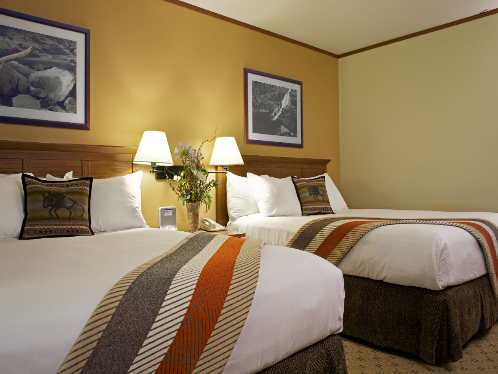 image A serene retreat with inviting beds and soft, warm accents, perfect for relaxation.