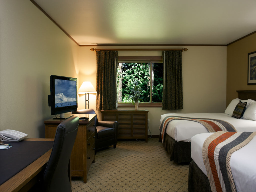 image A bright and cozy room featuring a welcoming workspace and tranquil views of the greenery outside.
