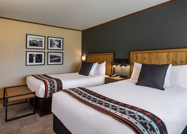 image A serene retreat featuring plush beds and soft lighting, perfect for a restful night’s sleep after a day of exploring.