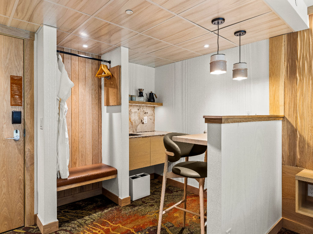 image A well-designed kitchenette and dining nook, perfect for enjoying light meals in a warm and inviting atmosphere.