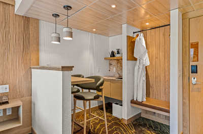 A thoughtfully arranged space with a kitchenette and dining area, providing functionality and comfort in an inviting layout.
