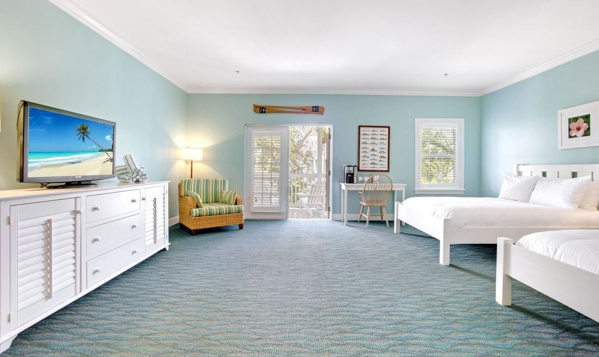 image Bedroom with two queen beds, TV, and tile floor