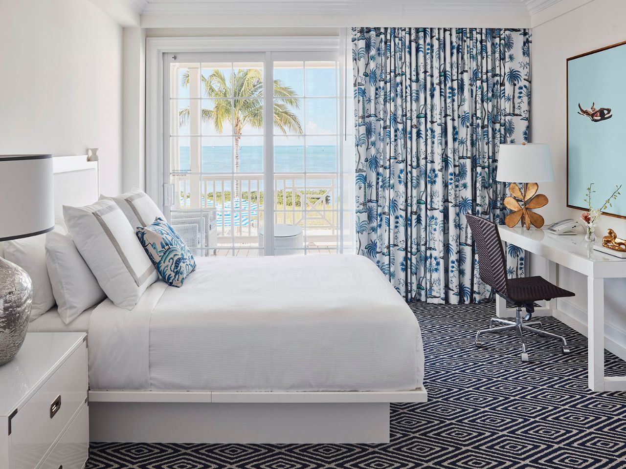 image Plush bed and ocean views combine to create a bright, inviting bedroom perfect for unwinding.