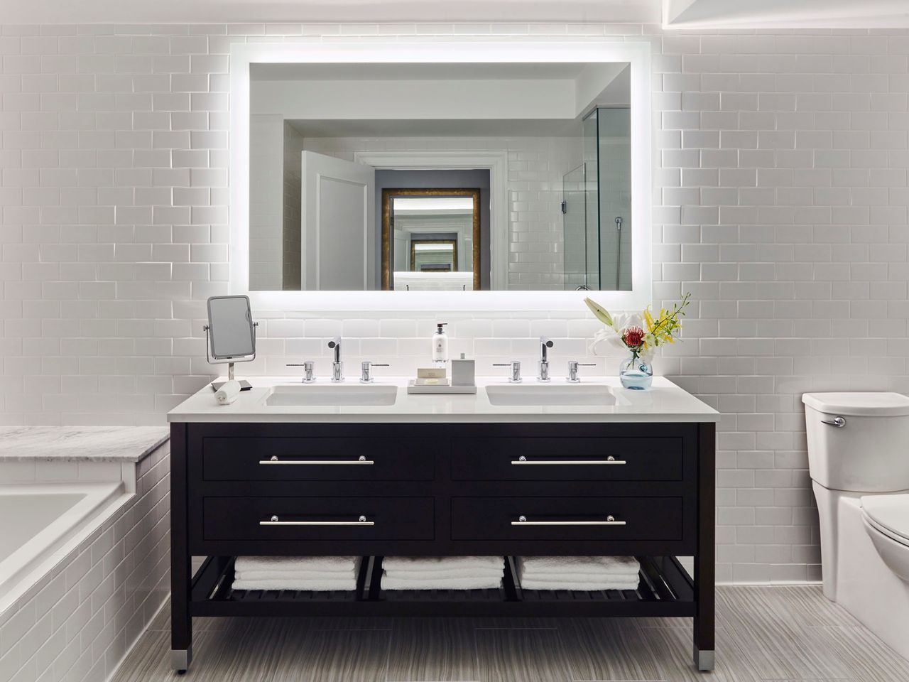 image Modern bathroom featuring a sleek dual vanity and calming ambiance for a spa-like experience.