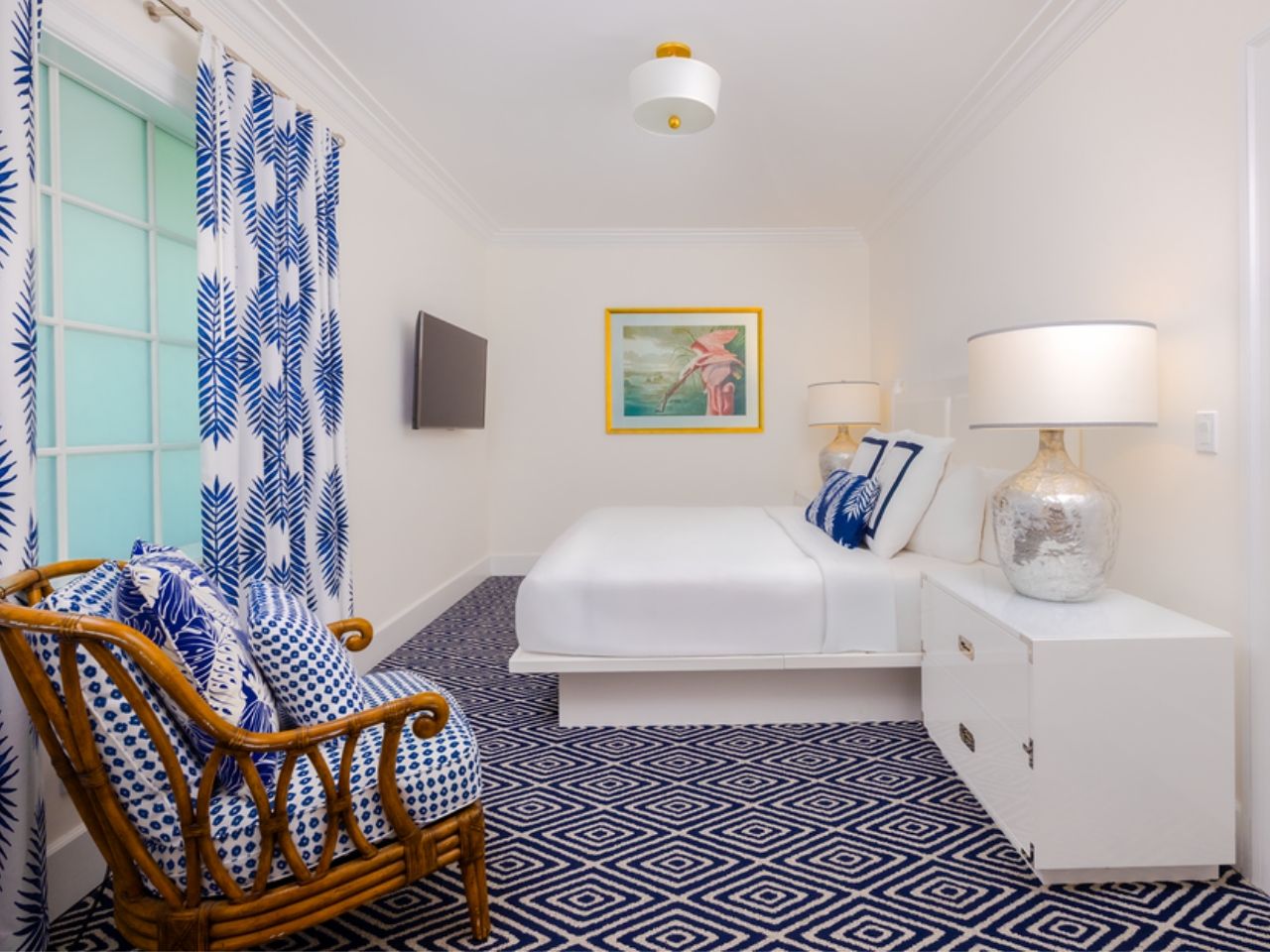 image Charming room with bold blue patterns and natural light, creating a cozy and cheerful retreat.