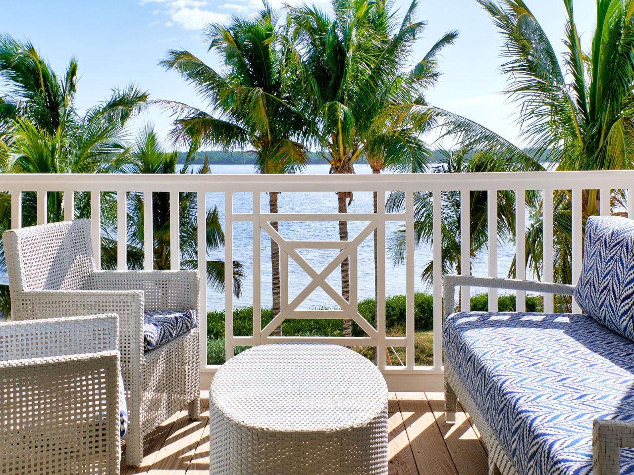 image Private balcony with stylish seating and tropical views, offering a peaceful escape under the palms.