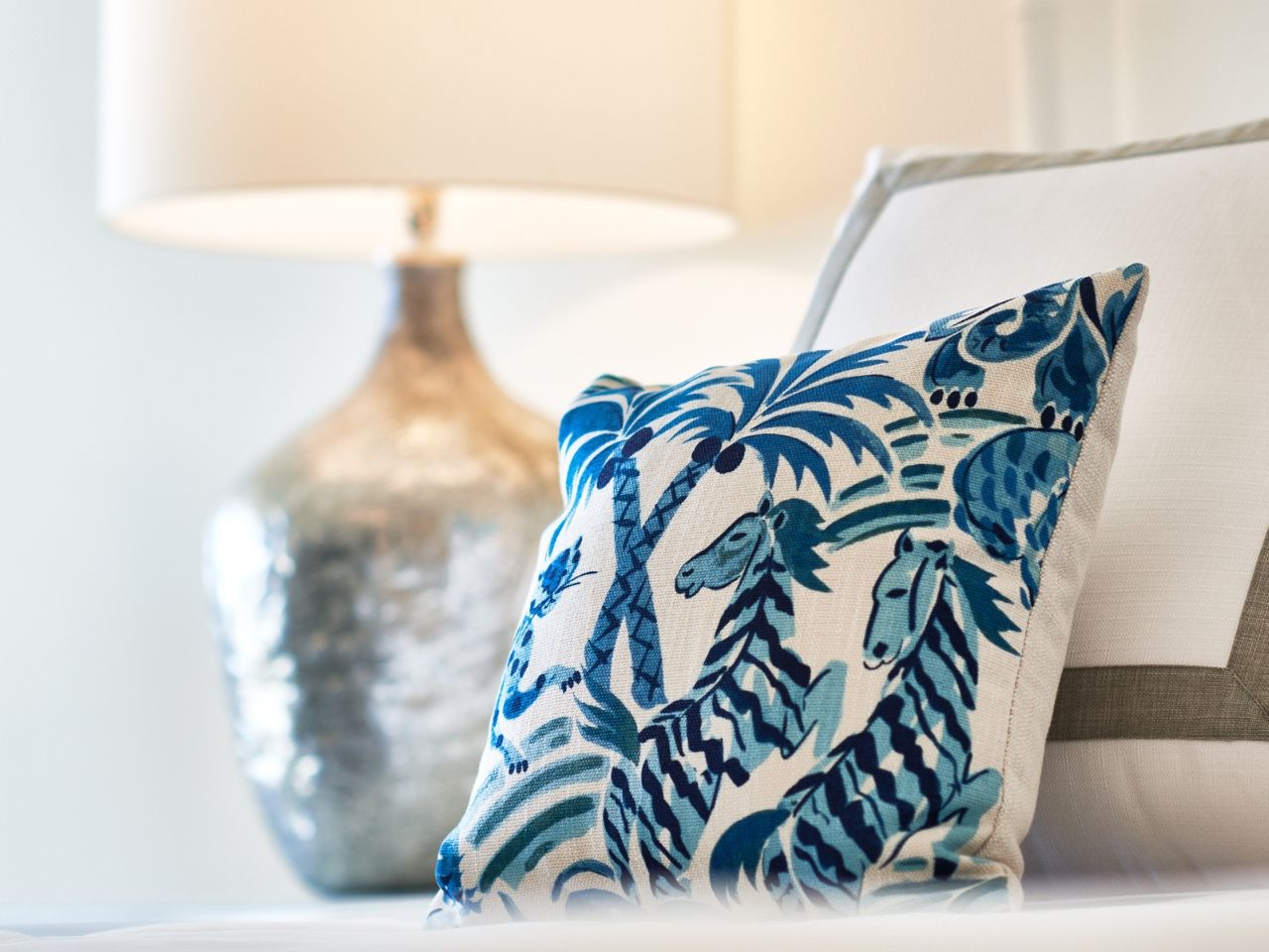 image Delicate decorative accents like patterned pillows bring a pop of charm and personality to the space.