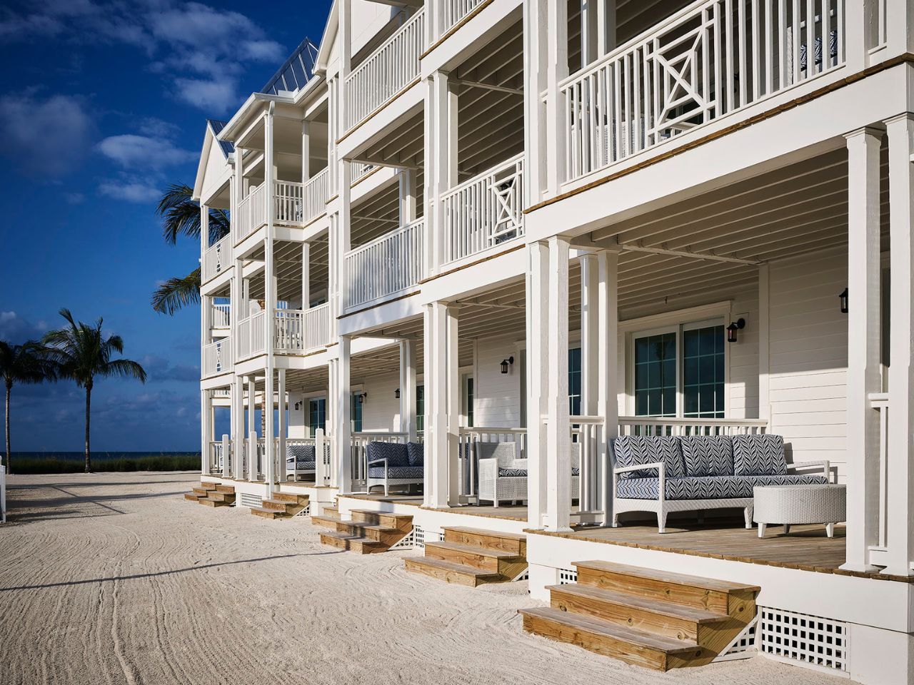 image Elegant verandas lead to private retreats, blending coastal luxury with serene seaside views.