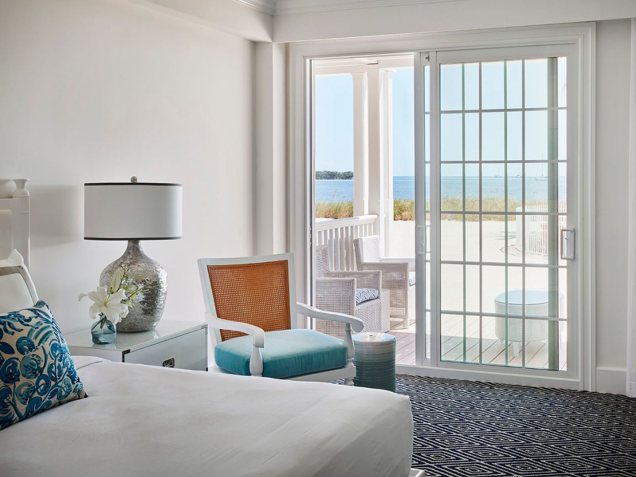 image Bright and tranquil bedroom with ocean views and a private balcony for peaceful mornings.