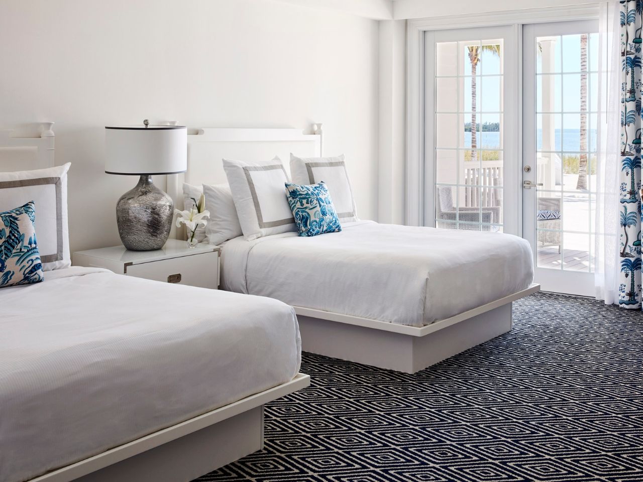 image Bright and airy bedroom with plush bedding and a private balcony, perfect for peaceful mornings.