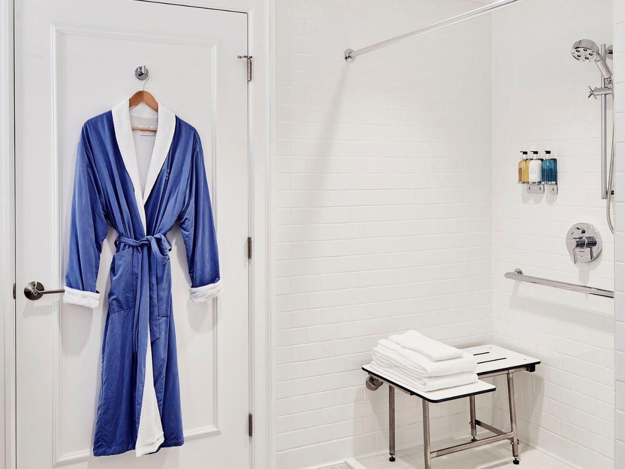 image Accessible bathroom thoughtfully designed with a spacious shower and comfortable seating.