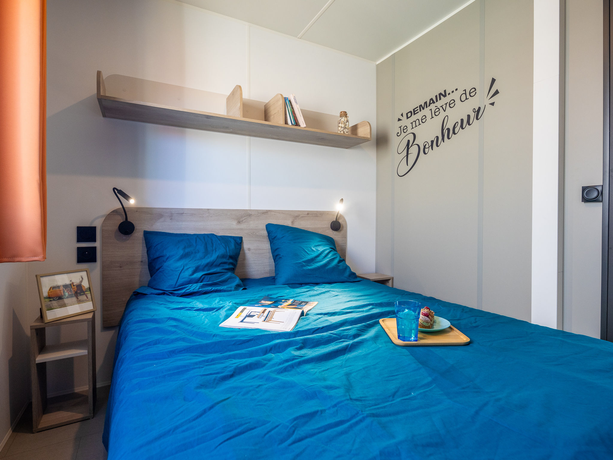 image Unwind in the cozy master bedroom with soft lighting and inviting decor, ensuring restful nights.