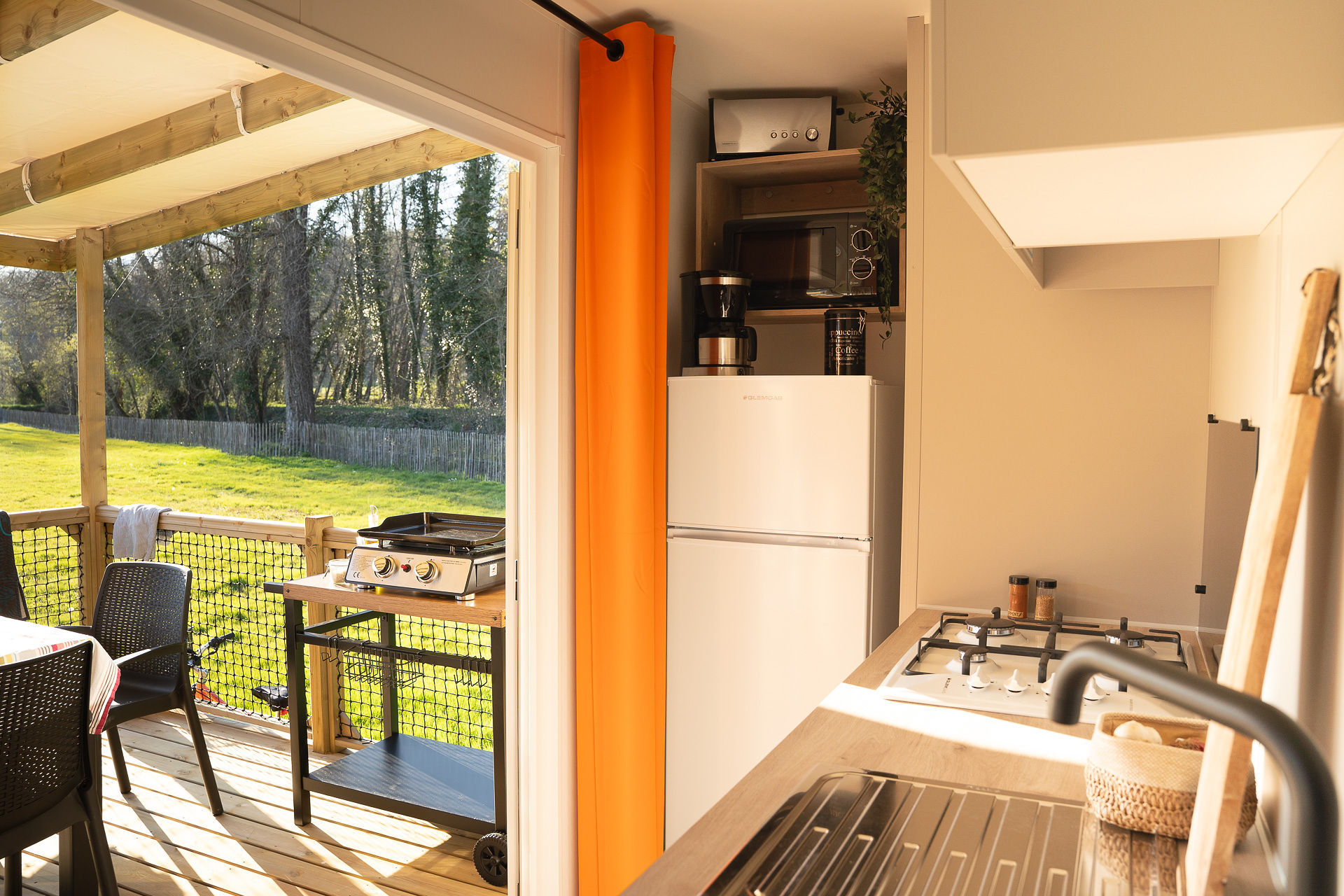 image This inviting kitchen overlooks a spacious terrace, perfect for family gatherings and outdoor dining.