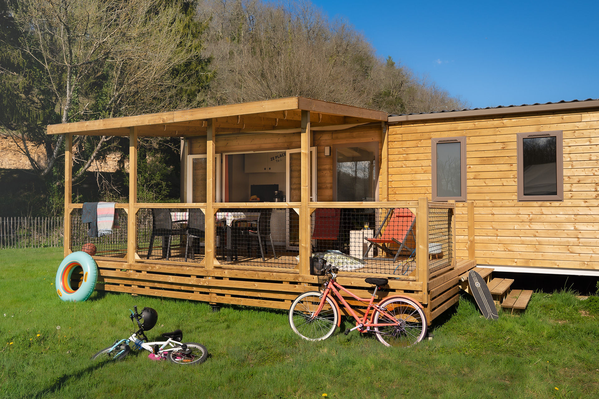 image The lovely terrace provides an idyllic space for family fun and relaxation, complemented by outdoor seating and easy access to the green surroundings.