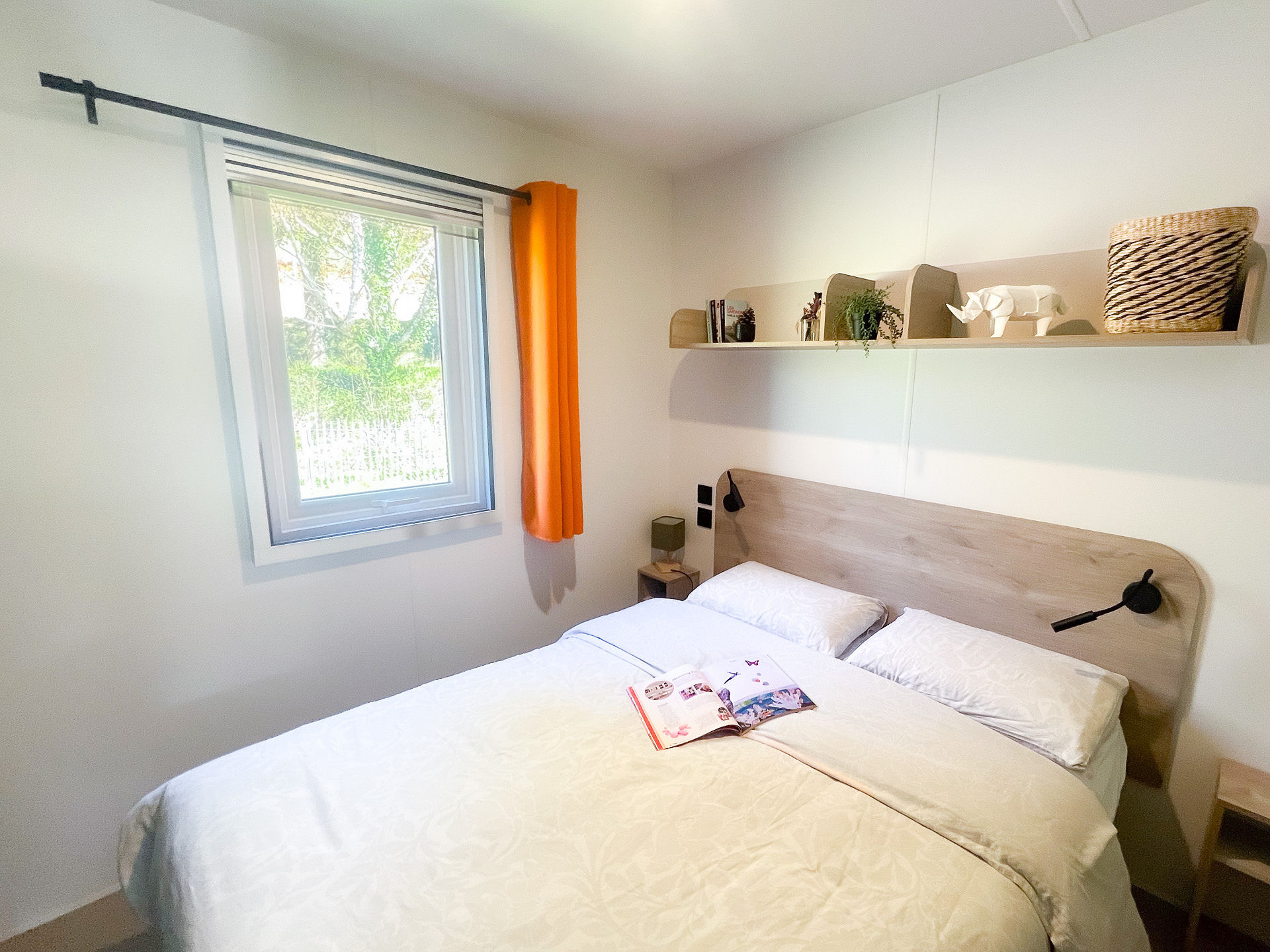 image A tranquil bedroom featuring stylish decor and playful accents, creating a perfect retreat for restful family nights.