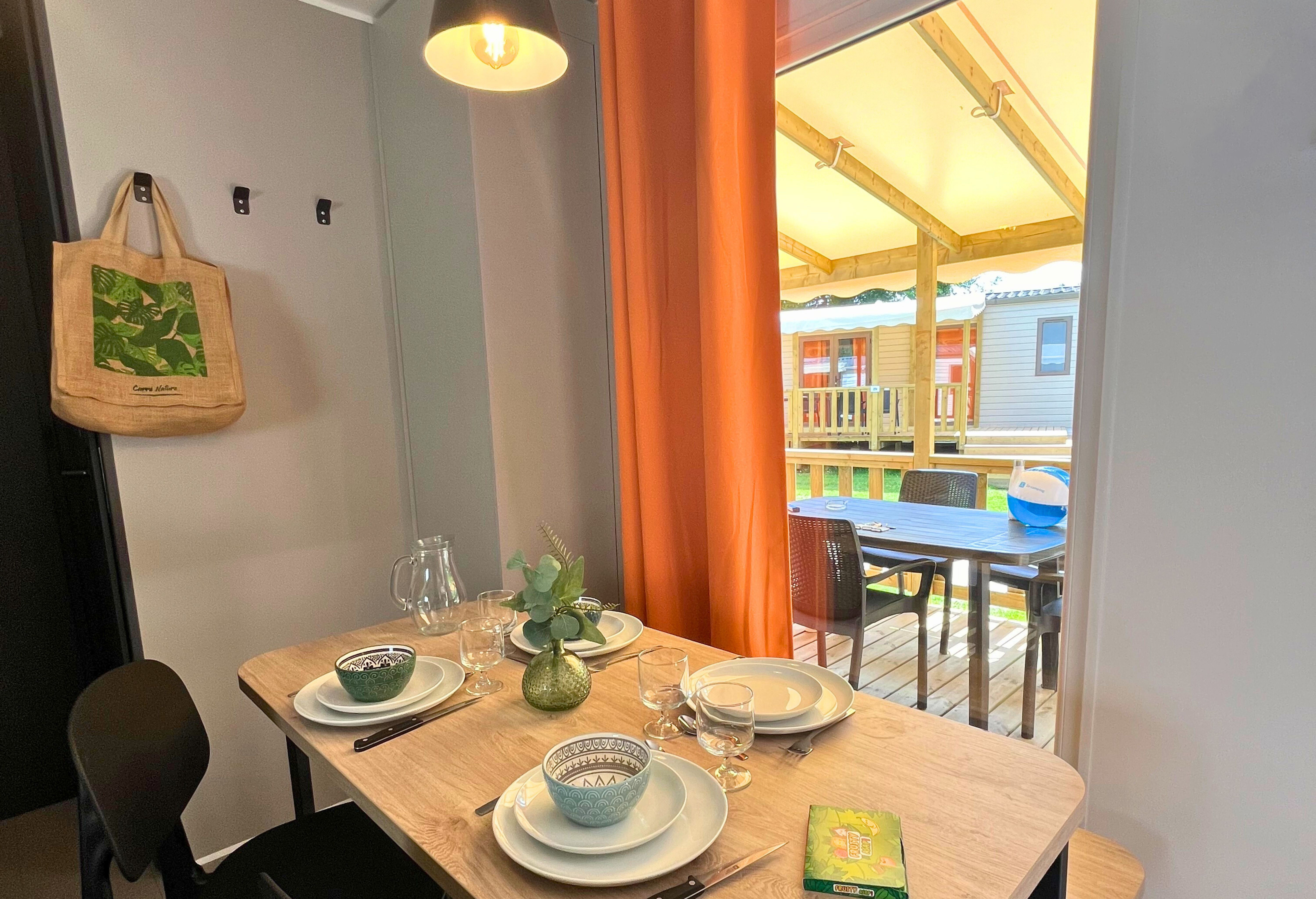 image Enjoy cozy indoor dining with a stylish setup, perfect for family meals or a quiet dinner after a day of adventure.