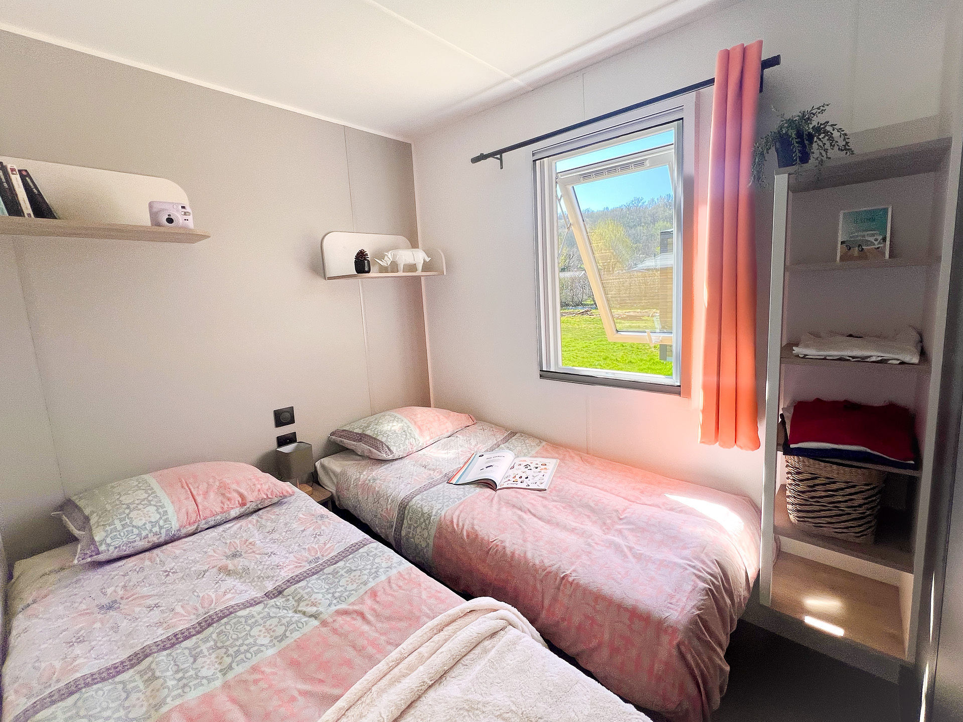 image Bright and airy, this twin bedroom invites restful nights and lively mornings, providing an ideal space for siblings to bond and enjoy their time together.