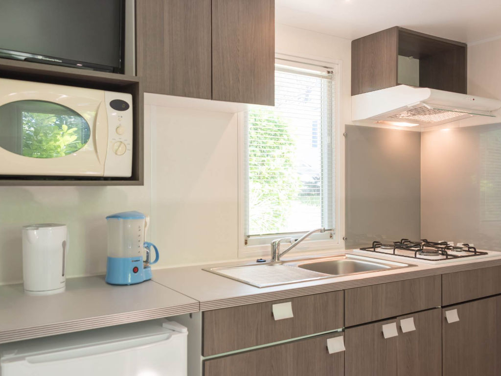 image Fully equipped kitchenette with all the amenities for a convenient and enjoyable stay.