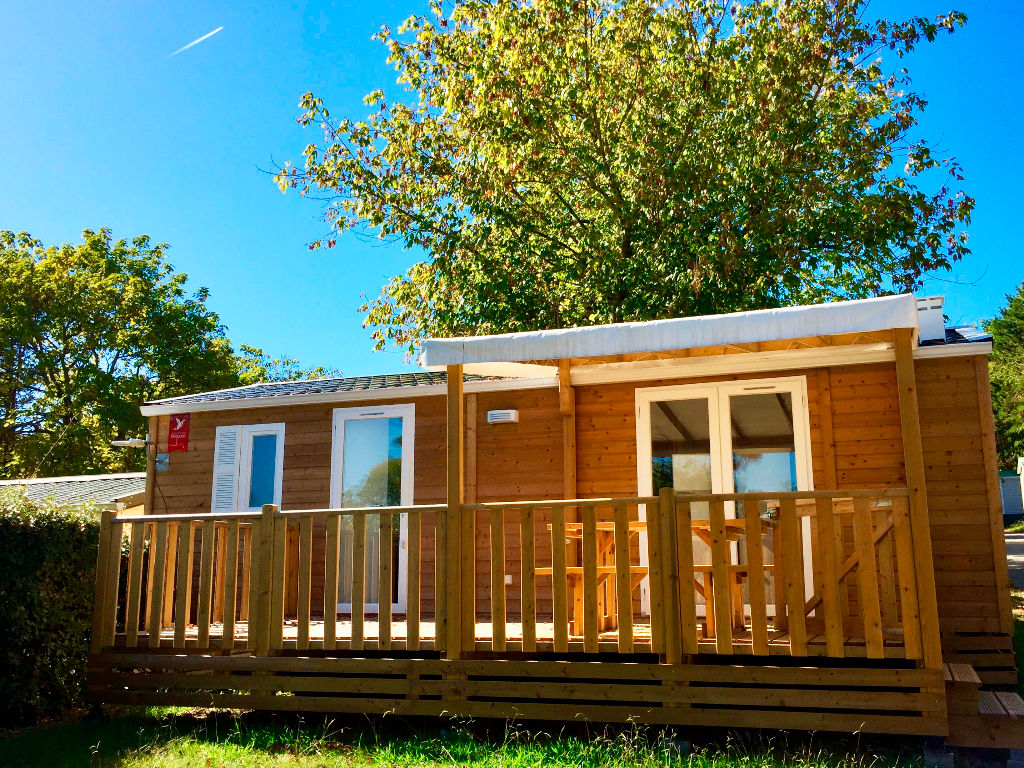 image Charming wooden terrace of the cottage, ideal for enjoying the serene natural surroundings.