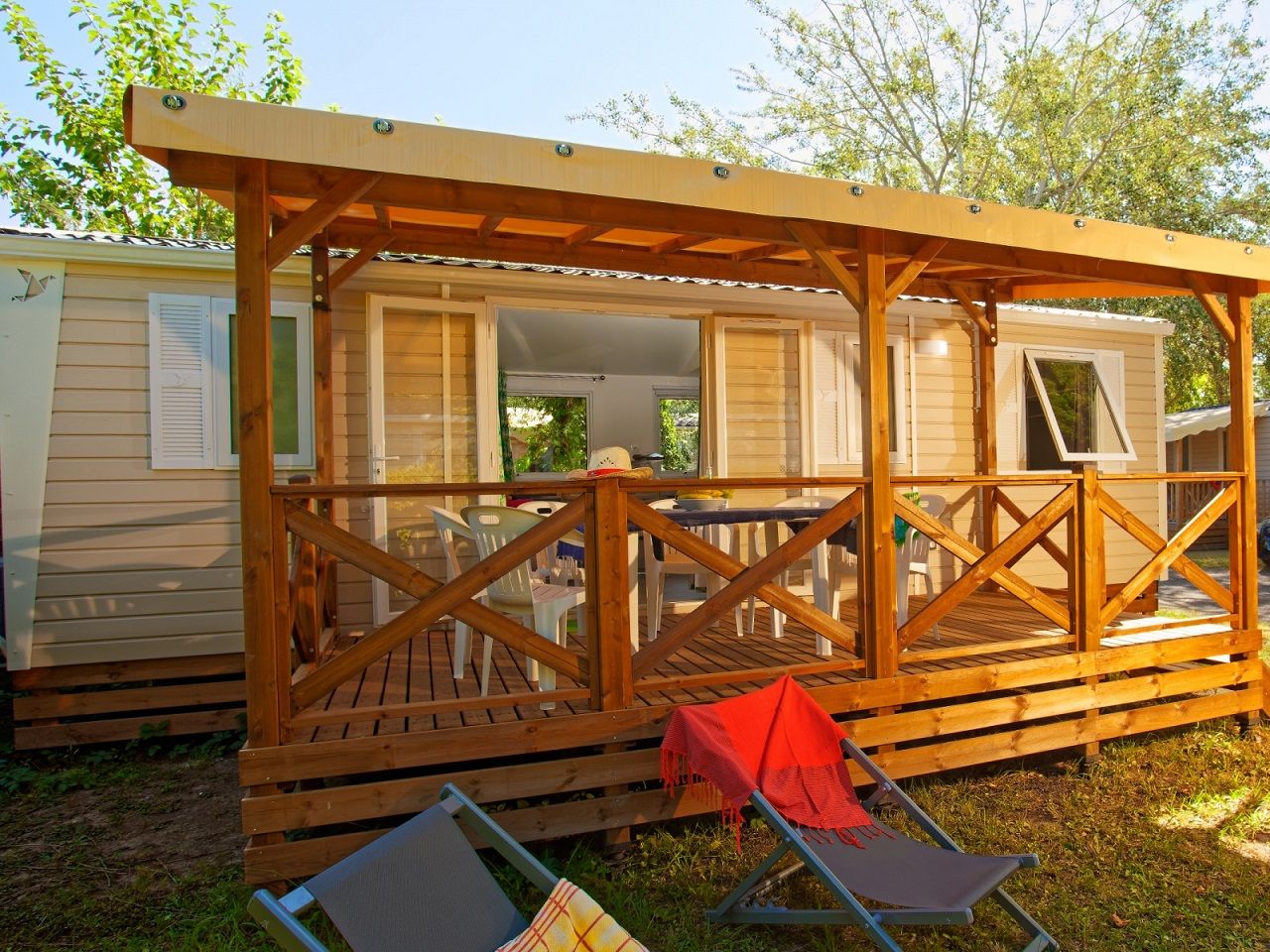 image "Relax on your covered terrace with comfortable seating, perfect for unwinding outdoors.