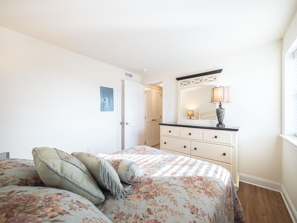 image Spacious and serene bedroom with soft bedding, ideal for a restful night's sleep.