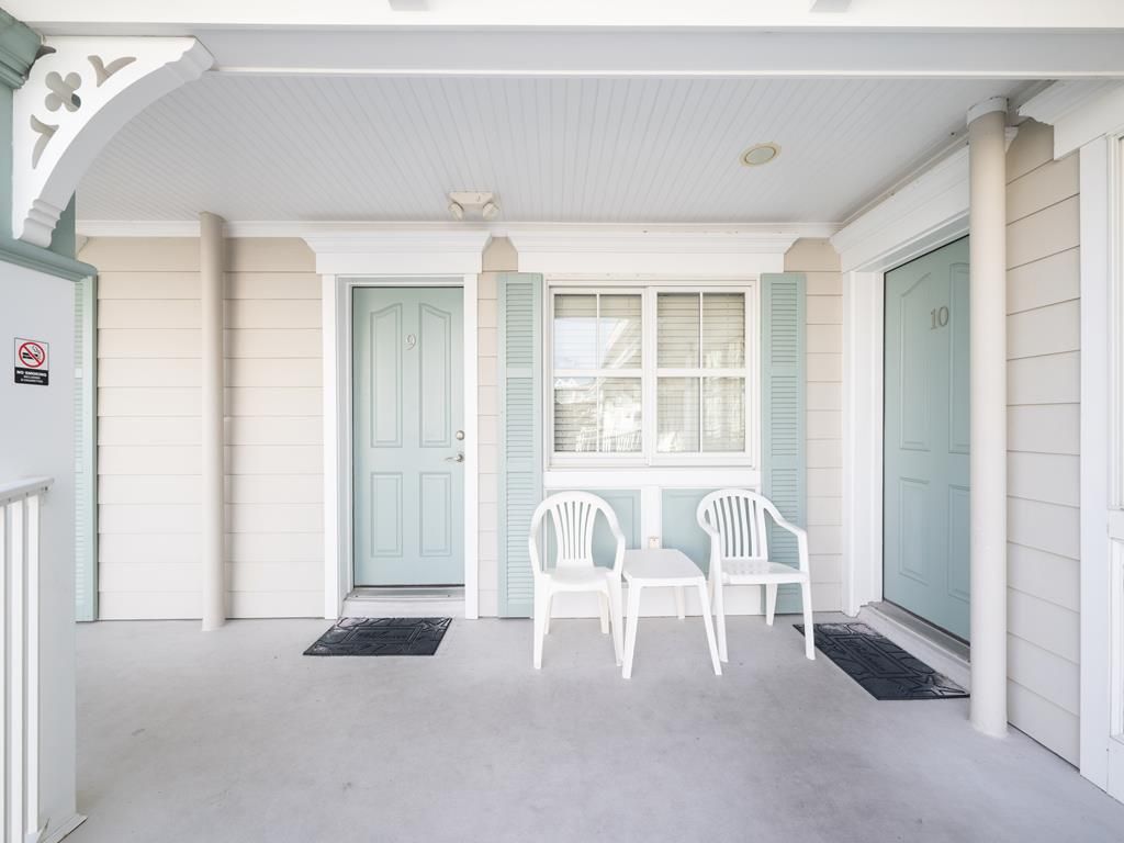 image Cozy covered patio with seating, perfect for enjoying your morning coffee or unwinding after a day at the beach.