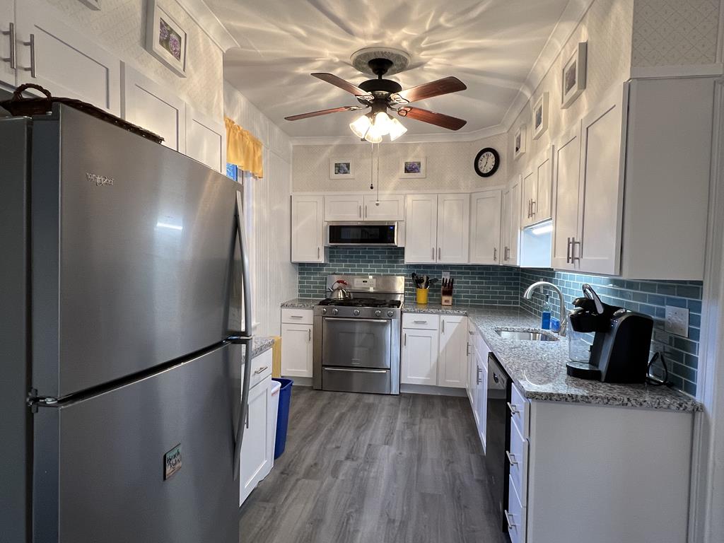 image Fully equipped kitchen featuring modern appliances, plenty of counter space, and everything you need to prepare meals for your group.