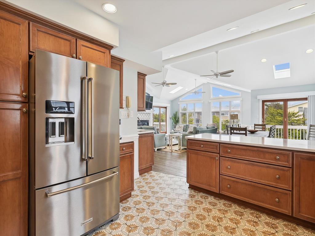 image Fully renovated kitchen with stainless steel appliances, ample storage, and a sleek design.