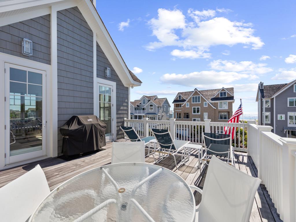 image Private balcony with outdoor dining space, perfect for enjoying meals with a view.