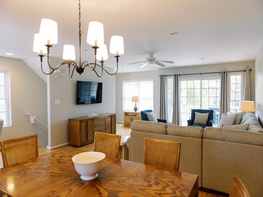 image Elegant dining area with a modern chandelier, perfect for enjoying meals with family and friends.