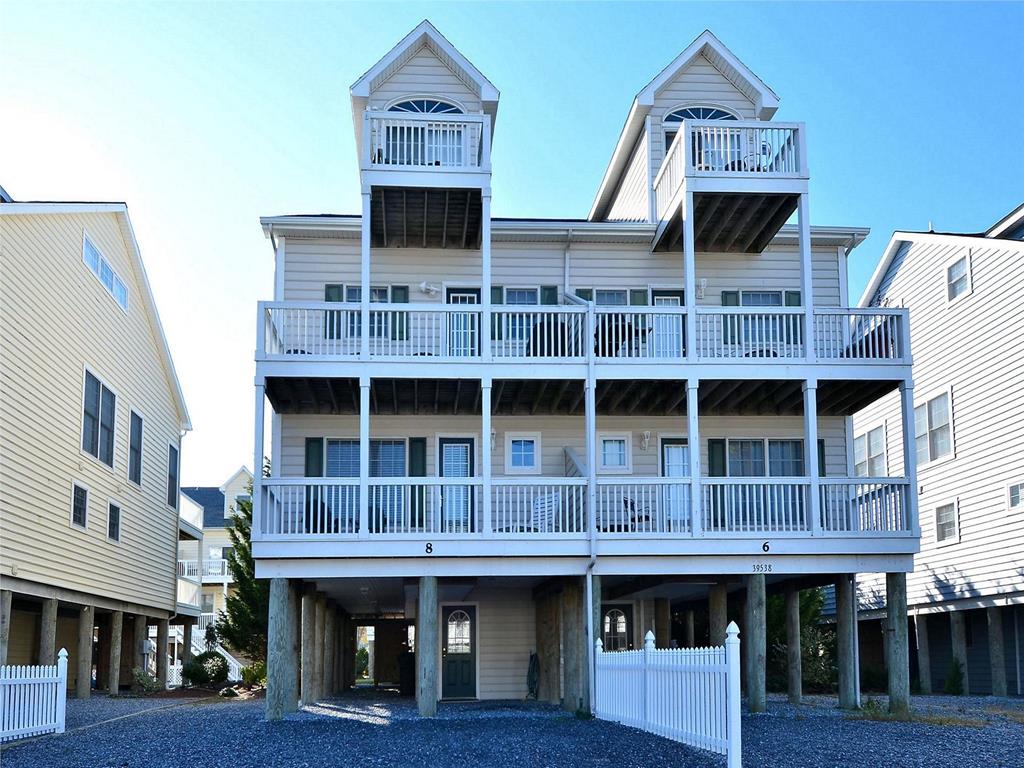 image Stunning multi-level townhouse just steps from the beach, featuring spacious balconies for breathtaking ocean air.
