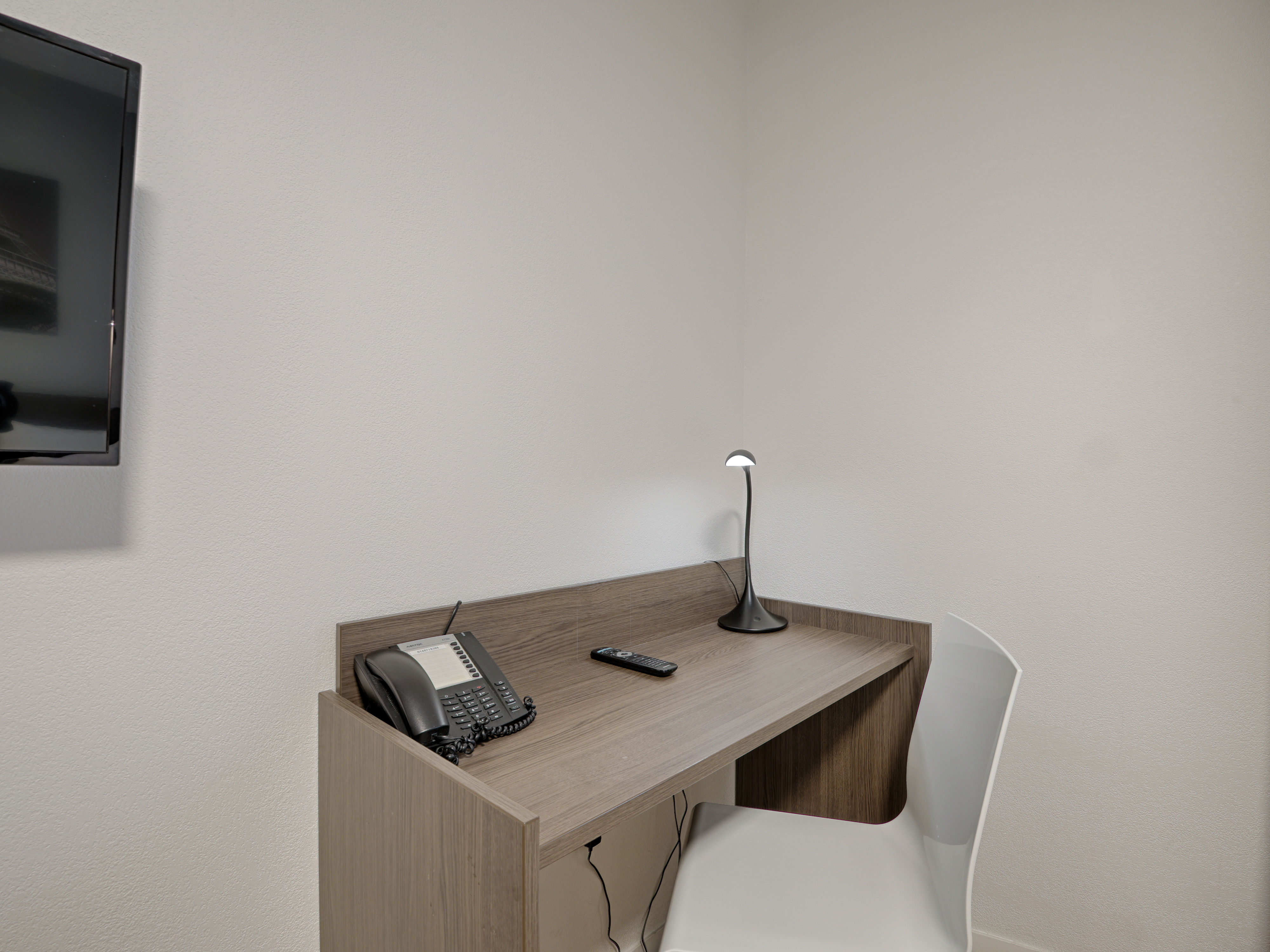 image Dedicated workspace within the studio, complete with a desk and chair, offering a comfortable spot for work or planning.