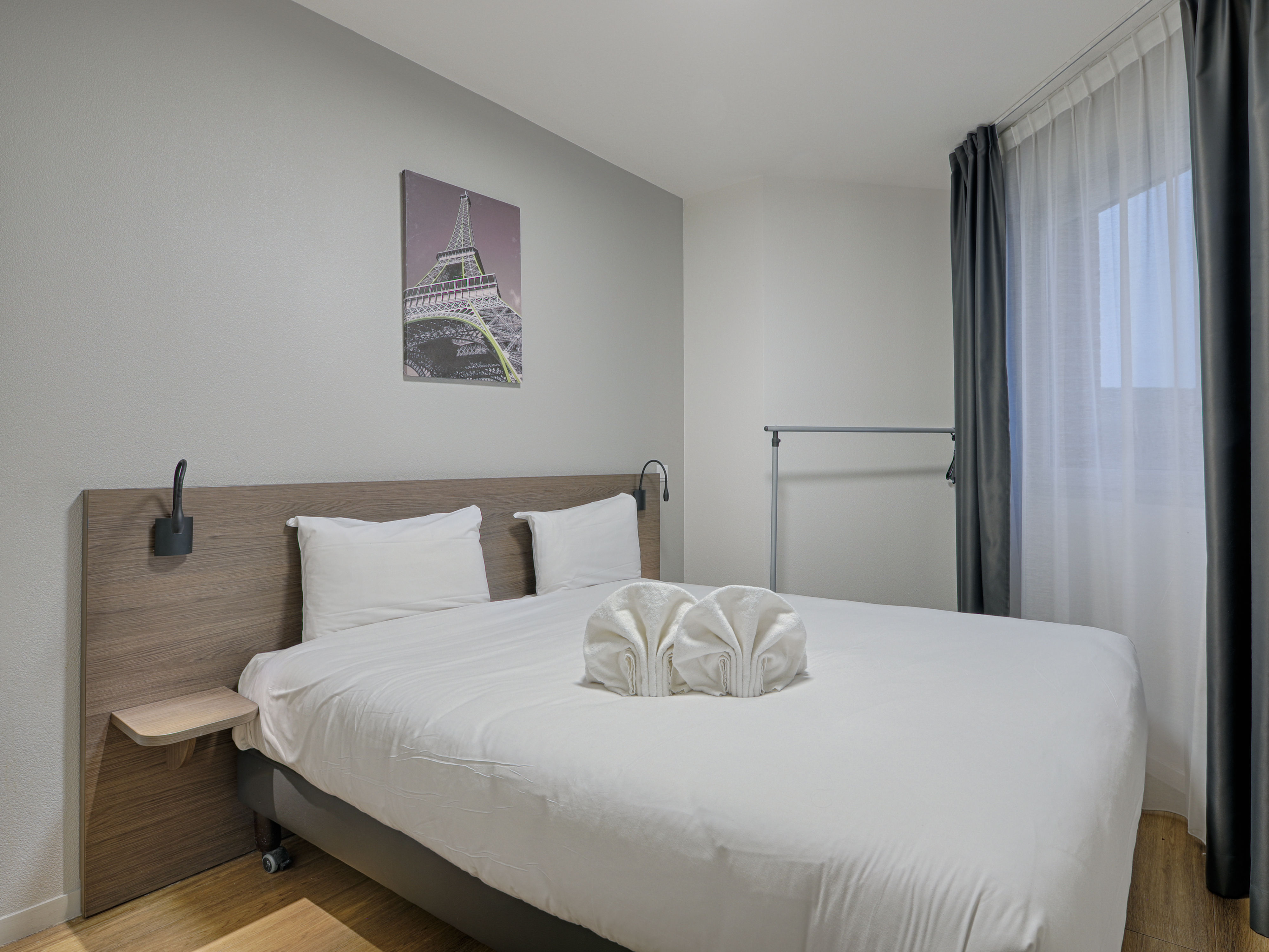 image Bright and cosy bedroom with a comfortable double bed, ideal for a restful stay.