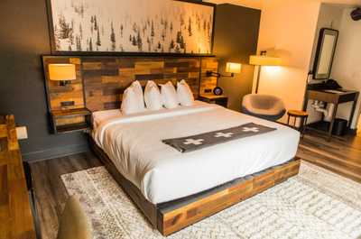 Cozy and stylish retreat with warm wood accents and soft lighting, creating the perfect space to unwind.