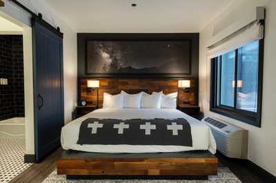 Inviting and serene setting with plush bedding and nature-inspired decor, offering a restful night's sleep.