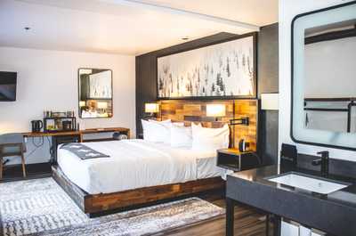 Chic and cozy retreat with warm wood tones and soft lighting, creating a serene escape from the everyday.