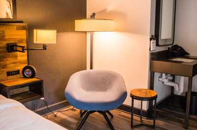 Inviting reading nook with plush seating and warm ambiance, perfect for a quiet moment of relaxation.