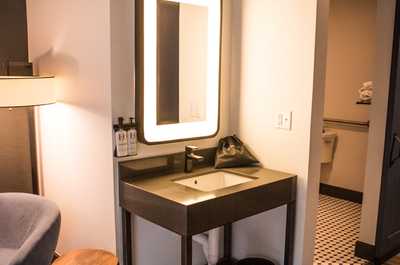 Elegant vanity area with soft lighting and sleek finishes, a peaceful corner to refresh and unwind.