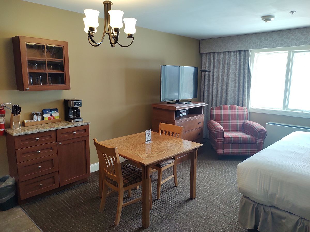 image This cozy ADA-accessible studio offers a comfortable seating area and kitchenette, perfect for two guests looking for a relaxing slope-side getaway with accessible features.