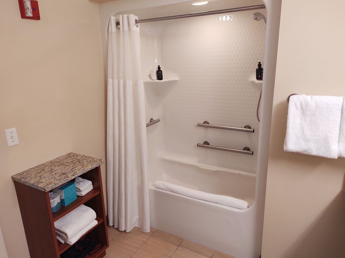 image Featuring a user-friendly layout, the accessible shower includes built-in grab bars and easy access, ensuring a safe and comfortable bathing experience.