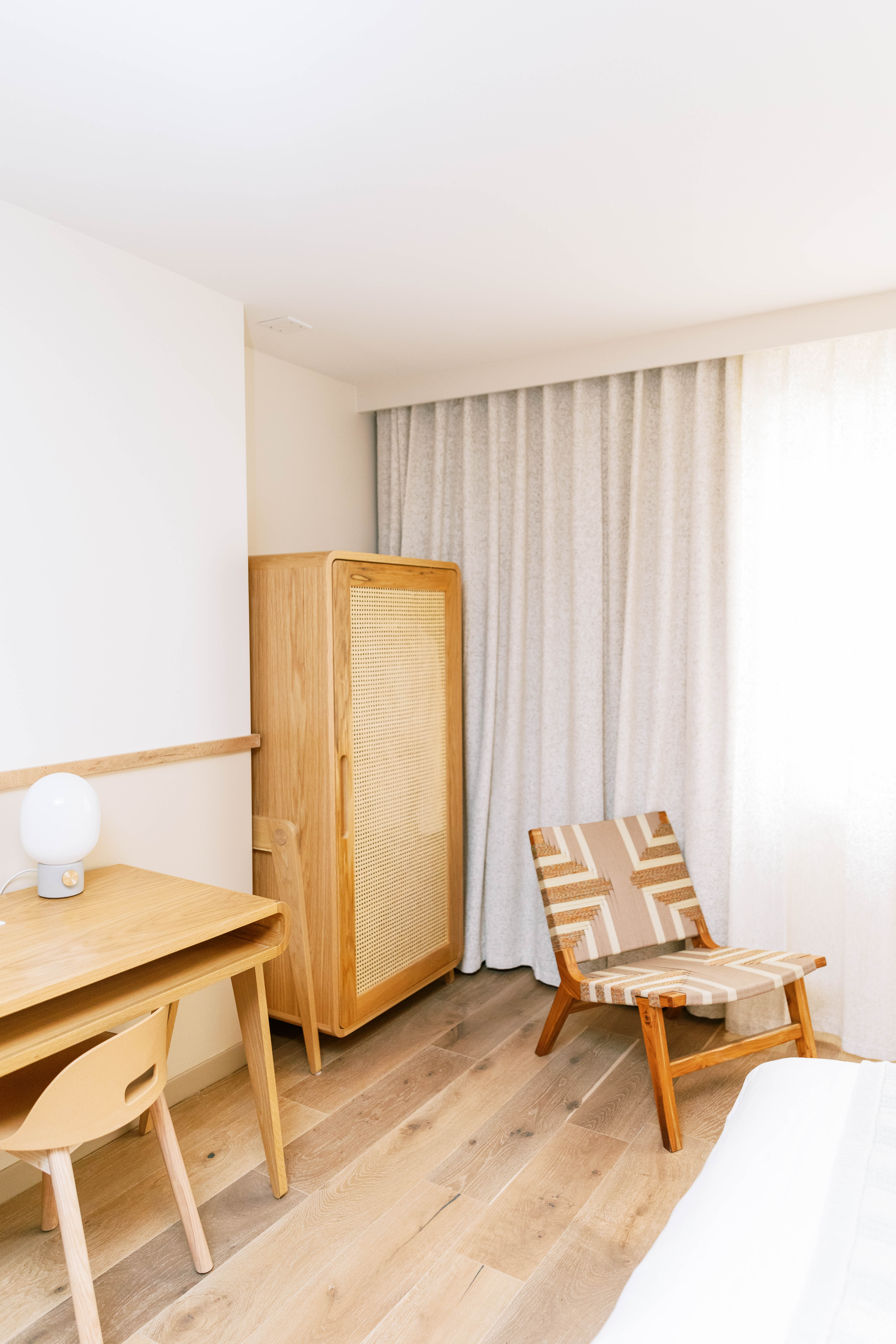 image Sunlit serenity meets modern simplicity—a cozy nook for unwinding after a day of exploring.