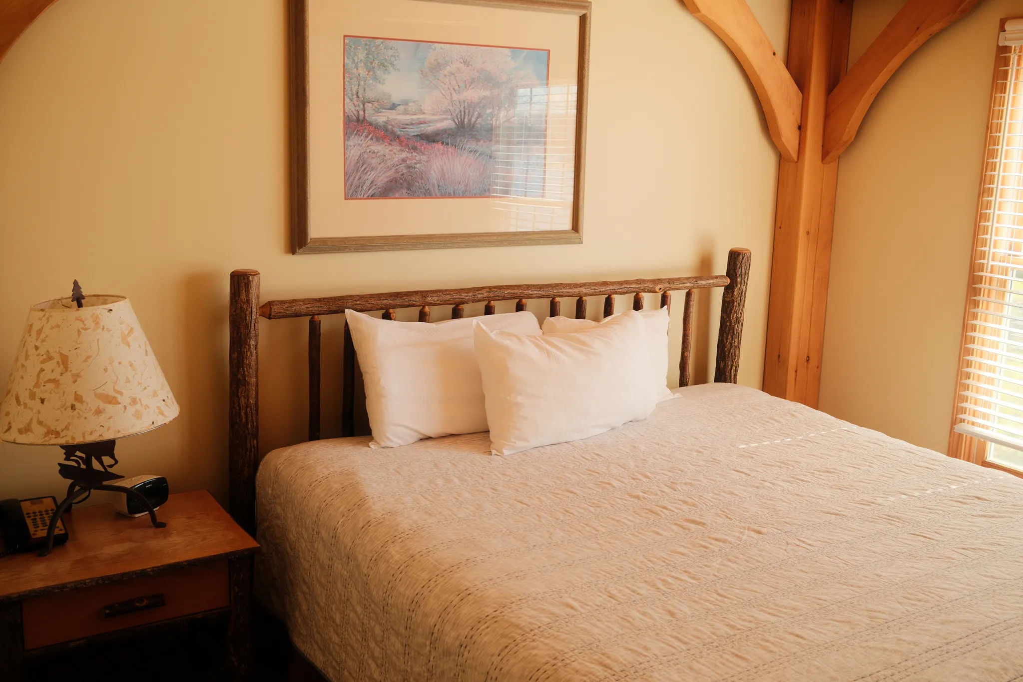 image Soft textures and natural light fill this peaceful bedroom retreat with warmth and rustic charm.