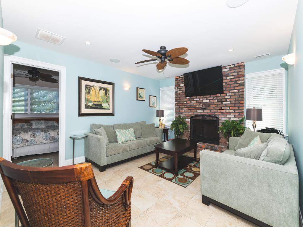 image Cozy living room with a fireplace and comfortable seating.