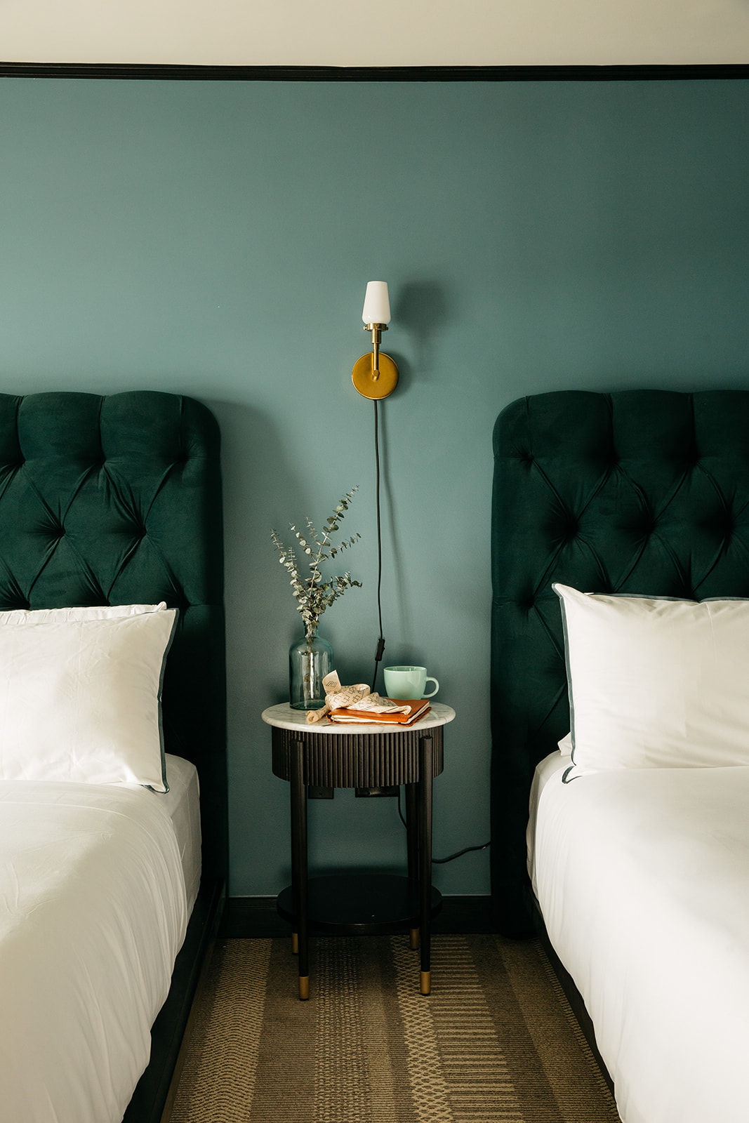 image Refined comfort with a bold touch, featuring plush bedding and deep hues for a restful stay.
